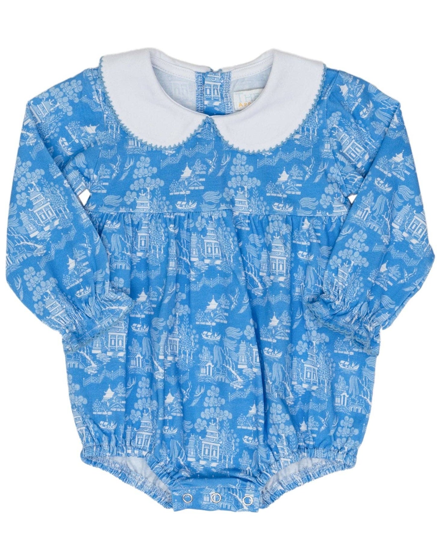 Blue baby romper with white pattern on a white background