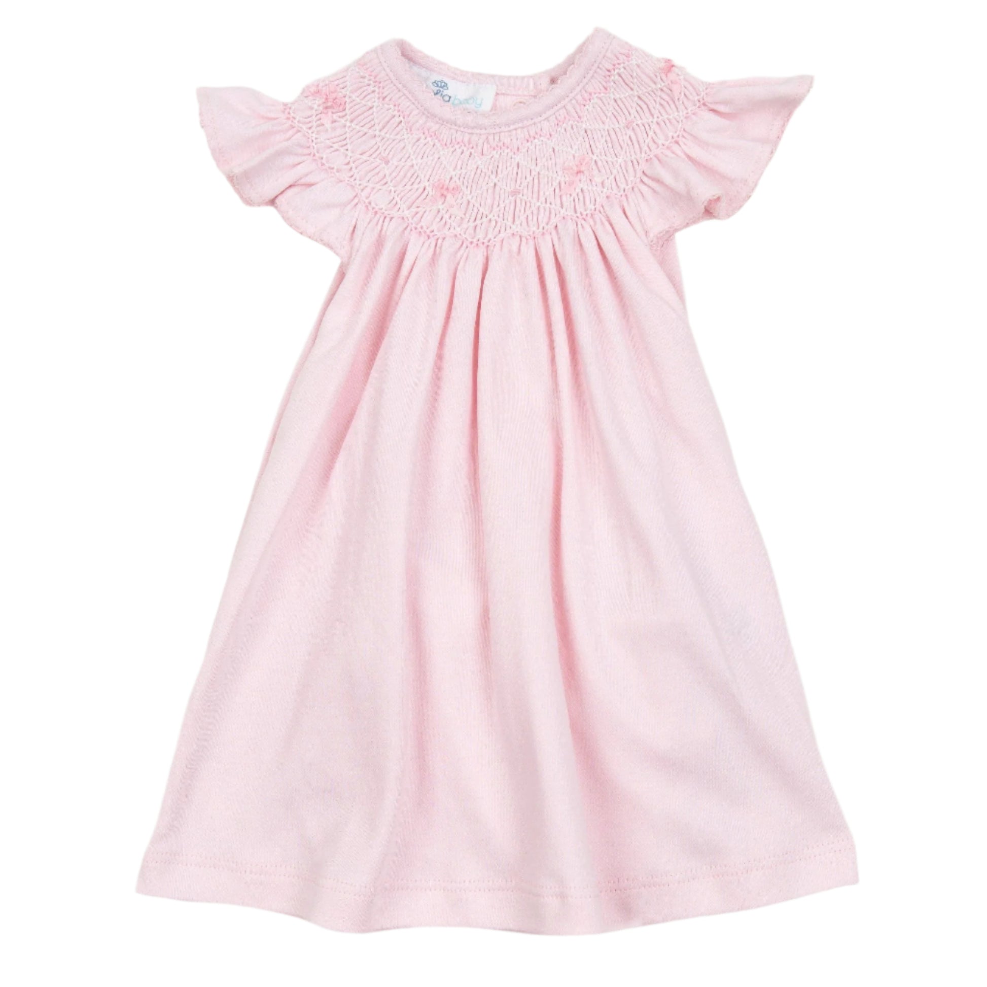 Pink baby dress with ruffled sleeves on a white background
