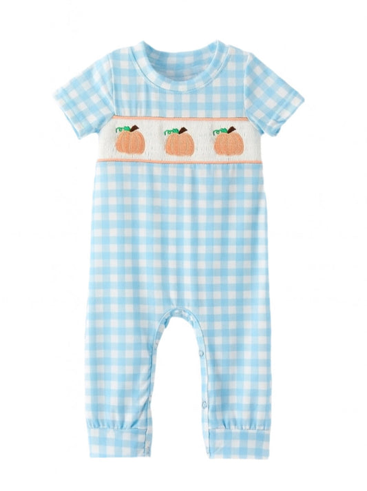 Baby romper with blue checkered pattern and peach design on a white background