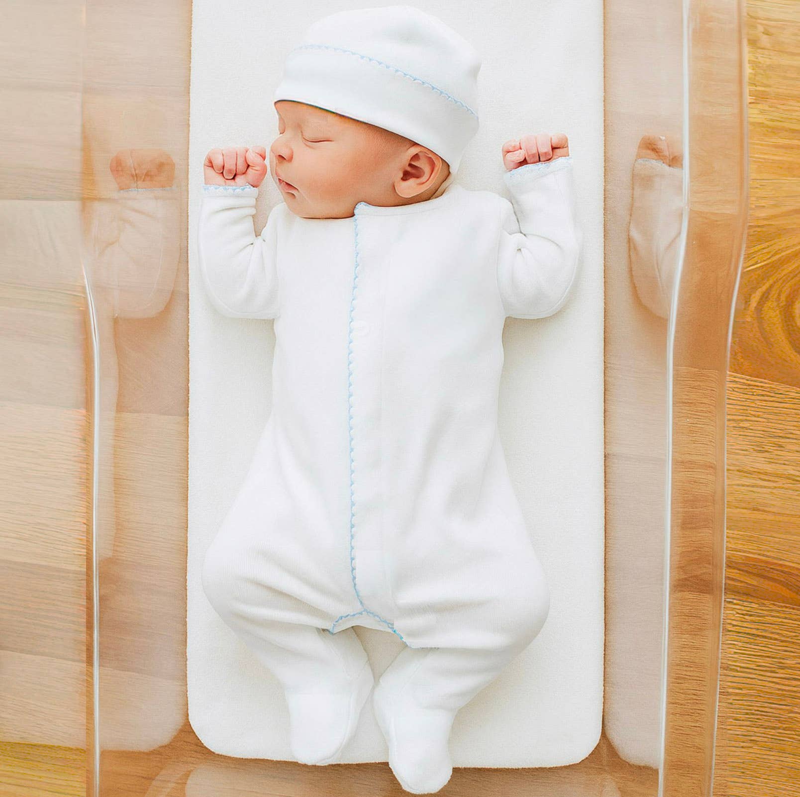 Solid Essentials White Footie  with Light Blue Trim Magnolia Baby